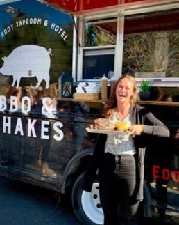 Rachel enjoying a meal at the eddy taproom and hotel food truck