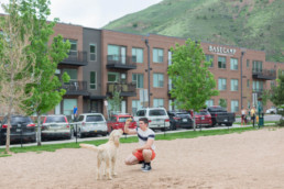 Man and dog at the dog park across the street from Basecamp