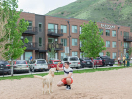 Man and dog at the dog park across the street from Basecamp