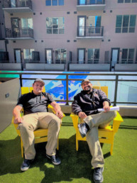 property management employees sitting on patio