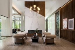 The lobby inside the Emerson leasing office, featuring a fireplace and elegant decor